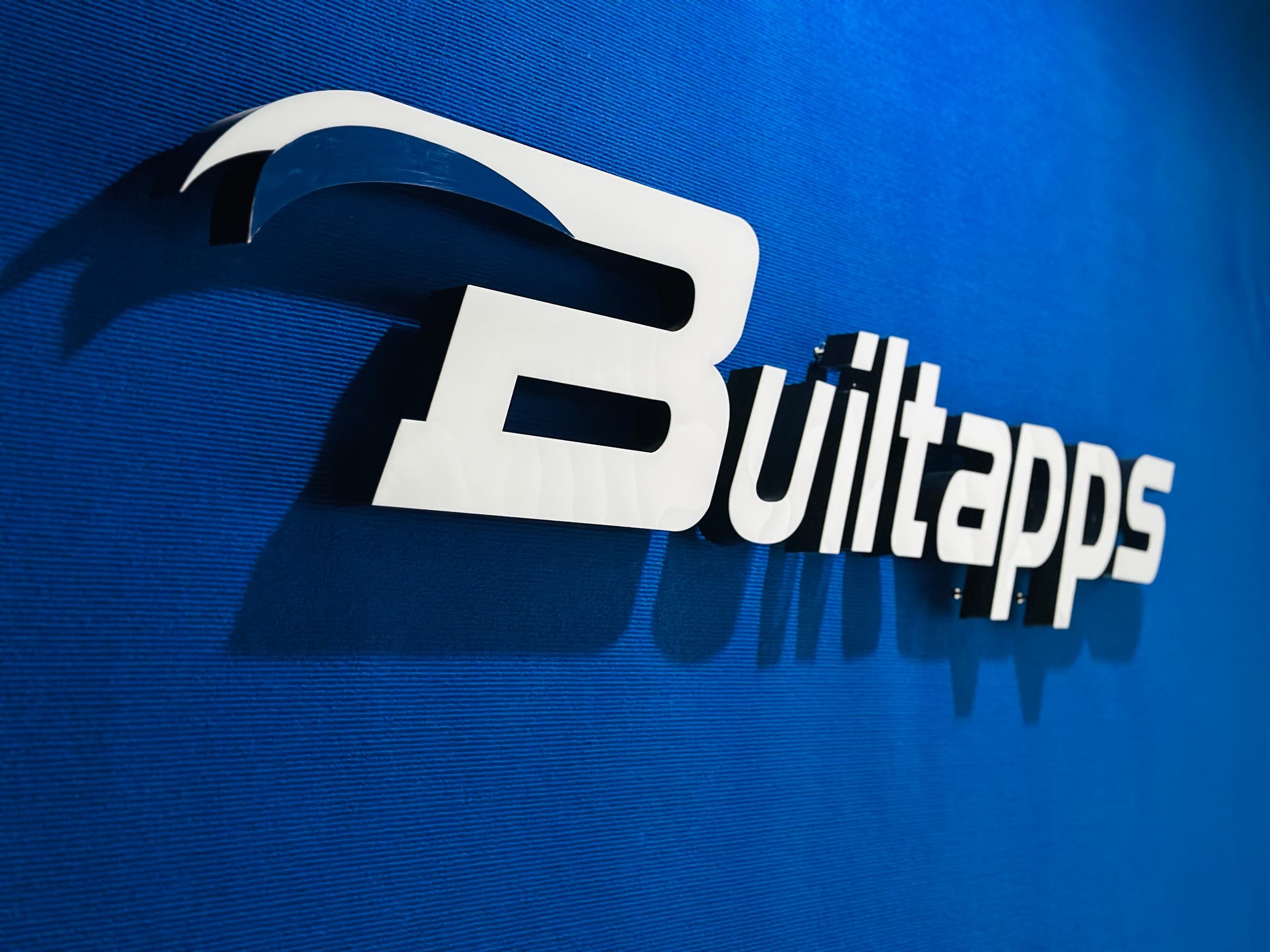 Builtapps logo on the office feature wall