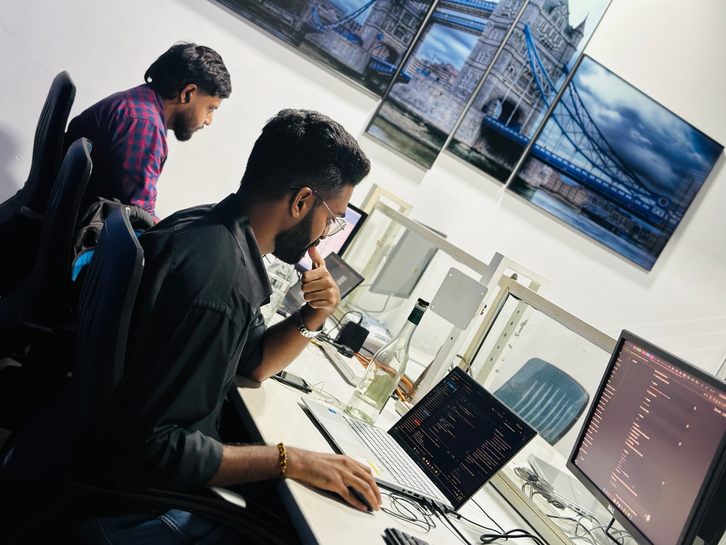 Developer working on code at a Builtapps desk