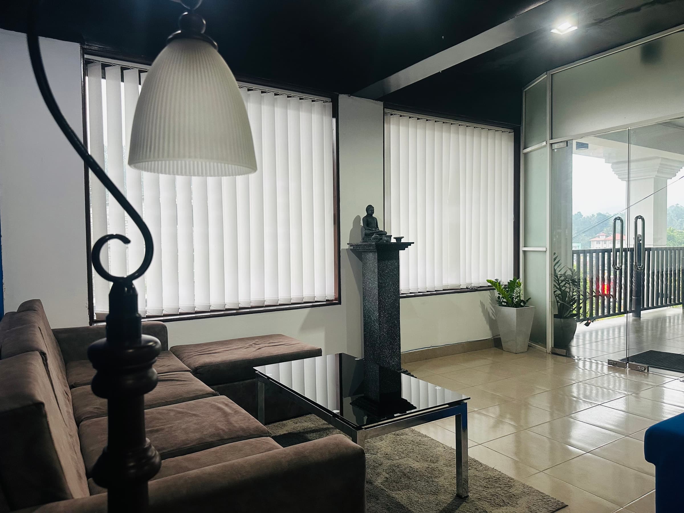 Builtapps office lounge with seating, coffee table, and windows
