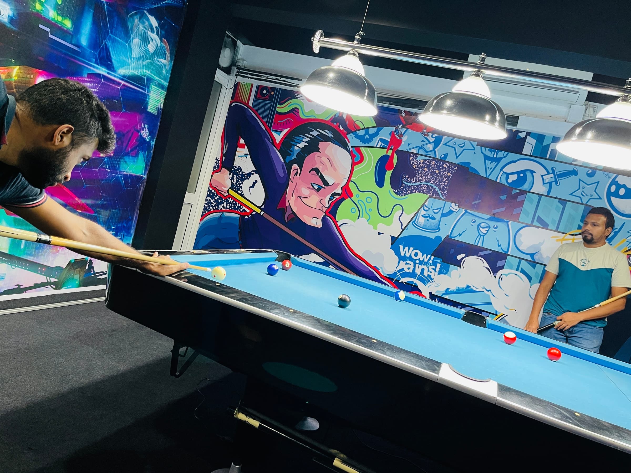Builtapps game room with pool table and mural art